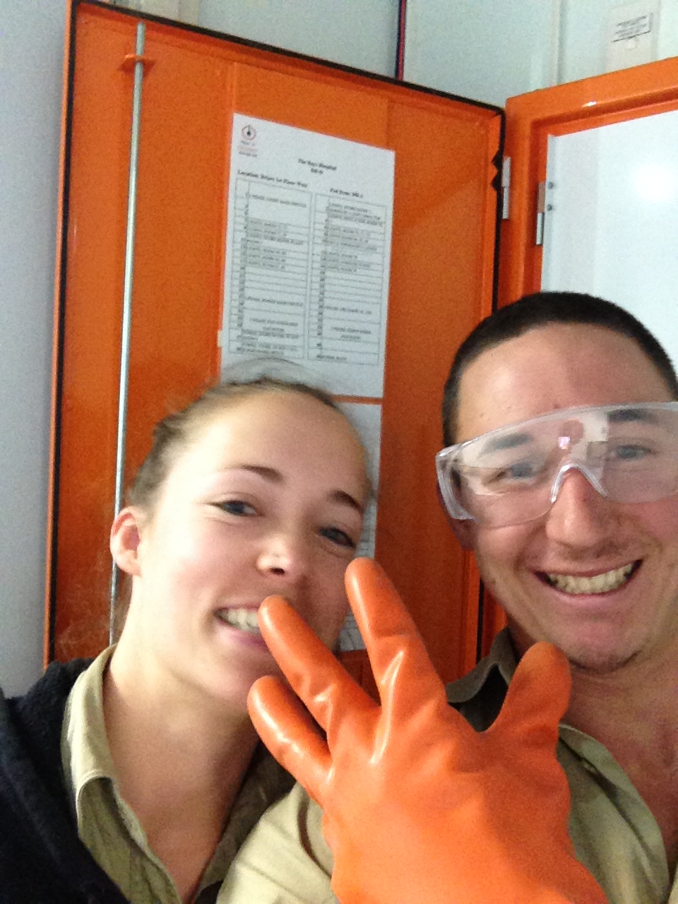 Two early Want A Sparky team members wearing electrical safety equipment