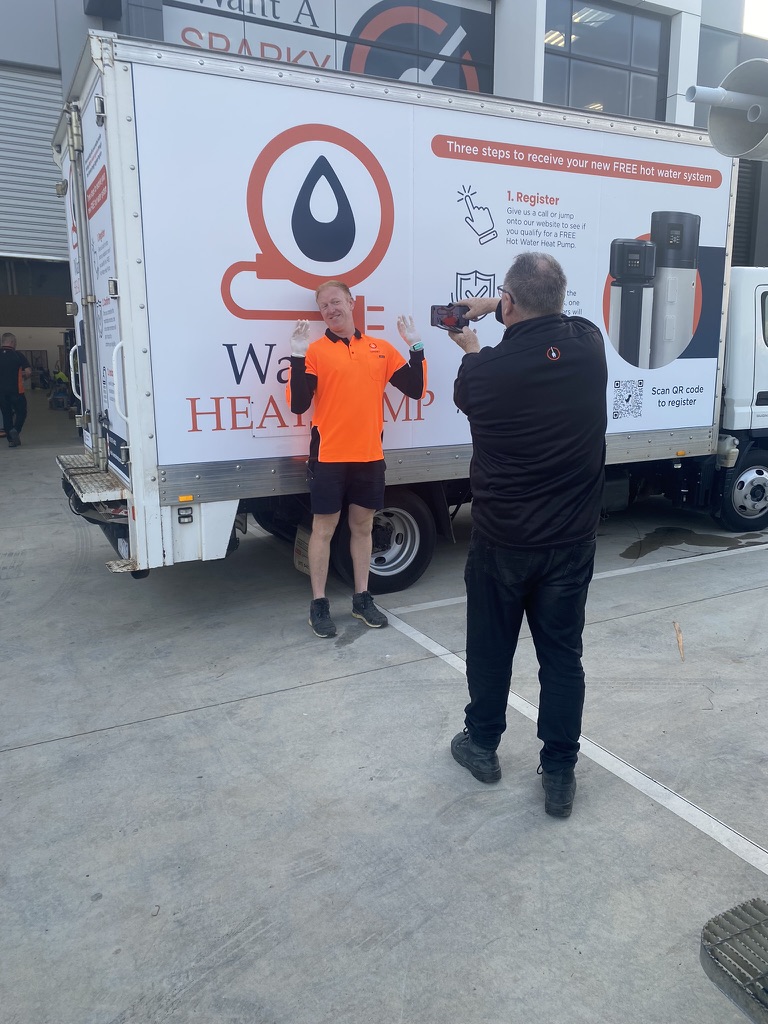 Want A Heat Pump promotional vehicle and team members